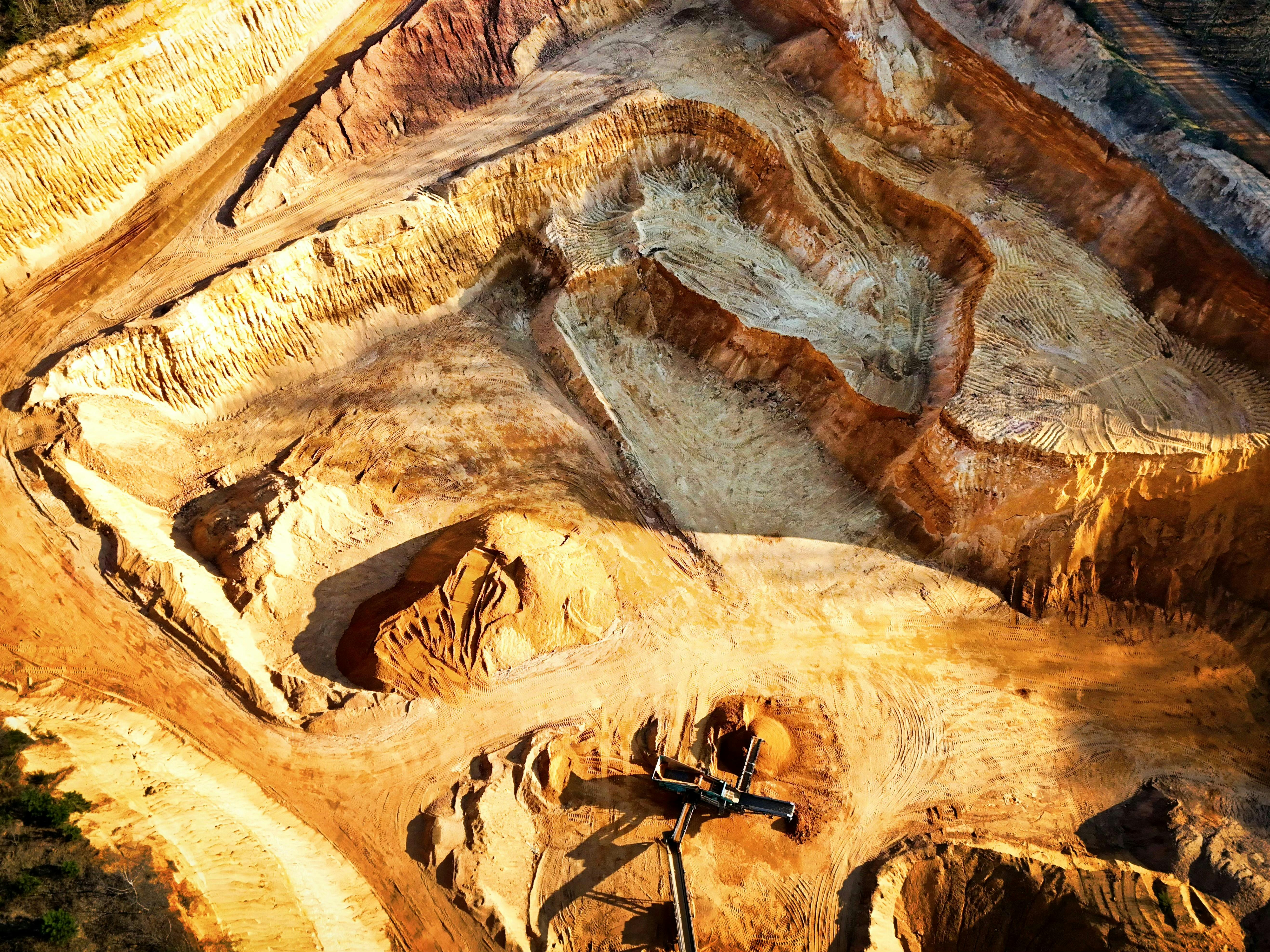 Aerial view of a terraced open-pit mine